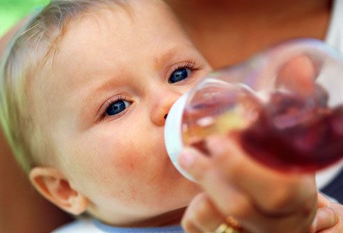 getty_rm_photo_of_constipated_baby_drinking_prune_juice